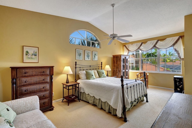 carpeted bedroom featuring lofted ceiling and ceiling fan