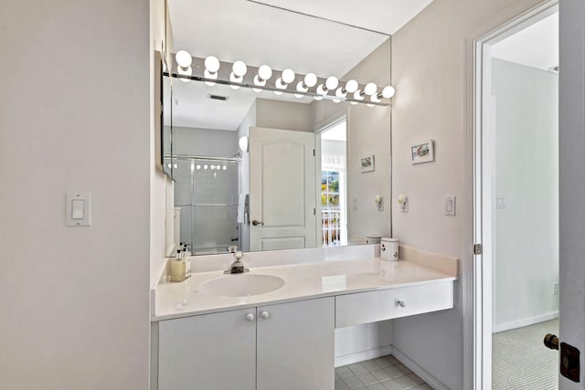 bathroom with vanity, tile patterned floors, and walk in shower