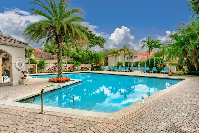 view of swimming pool with a patio area