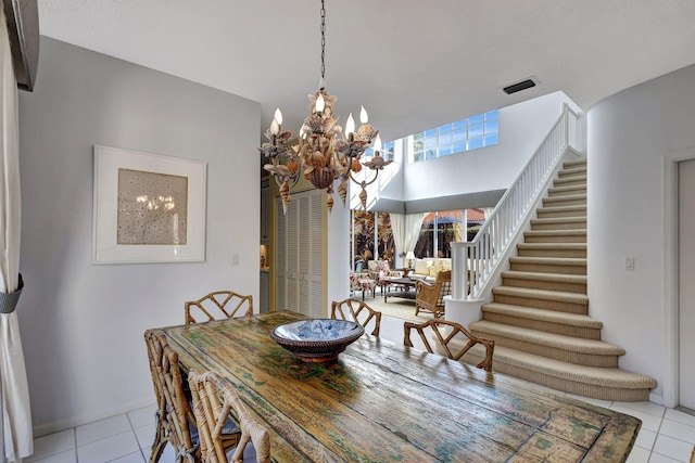 tiled dining area with a notable chandelier