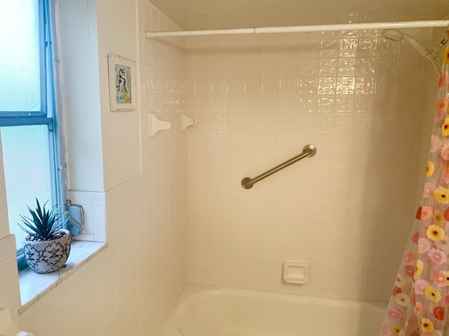 bathroom with shower / bath combo