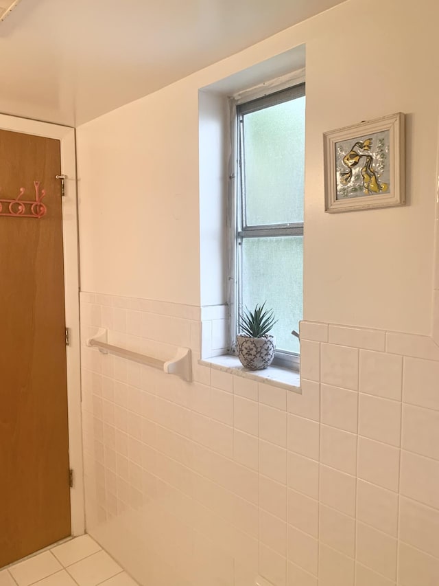 bathroom featuring tile walls and tile patterned flooring