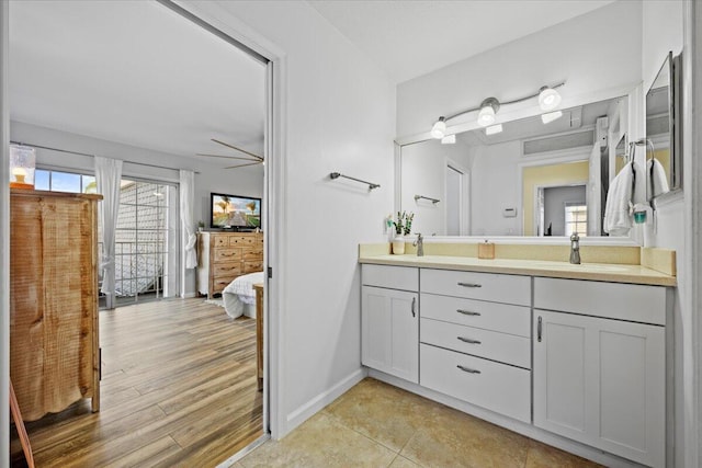 bathroom featuring ceiling fan and vanity