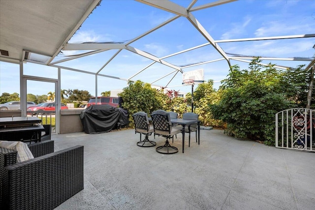 view of patio with a lanai and a grill