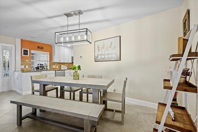 dining space featuring light tile patterned flooring