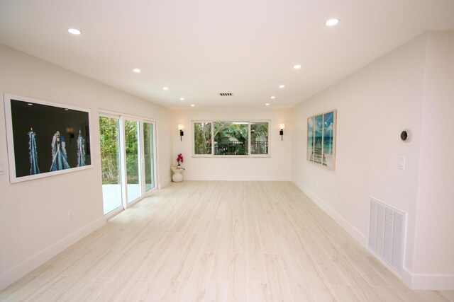 spare room featuring light hardwood / wood-style flooring