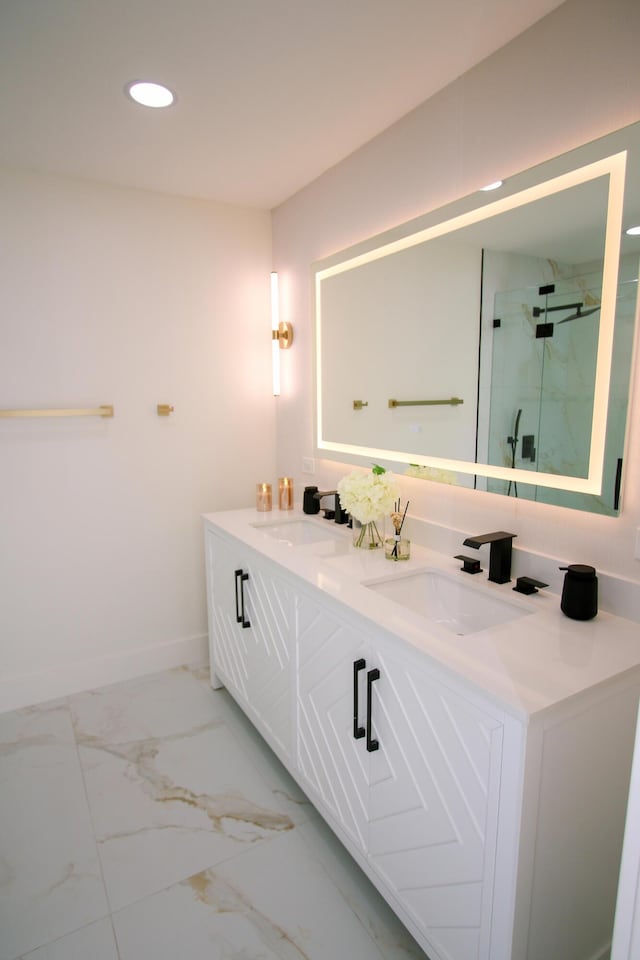 bathroom with an enclosed shower and vanity