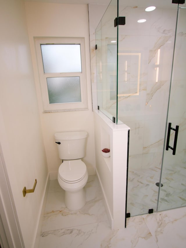 bathroom with toilet and walk in shower