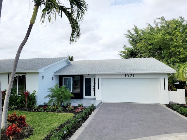 single story home featuring a garage