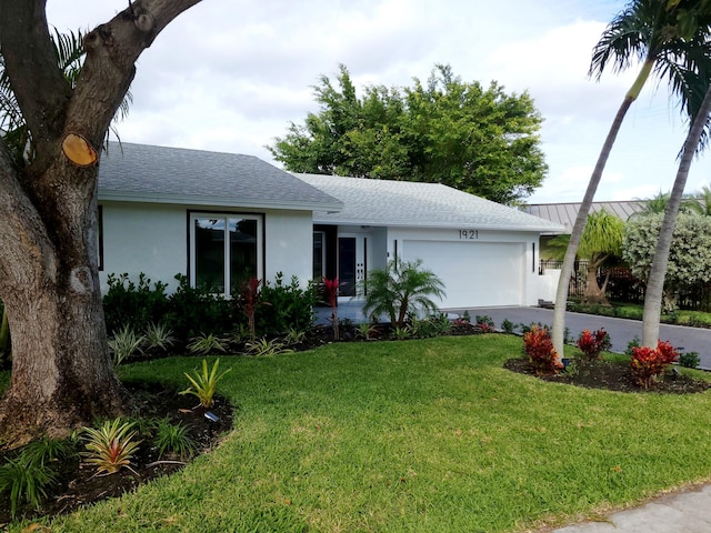 ranch-style house with a front lawn and a garage