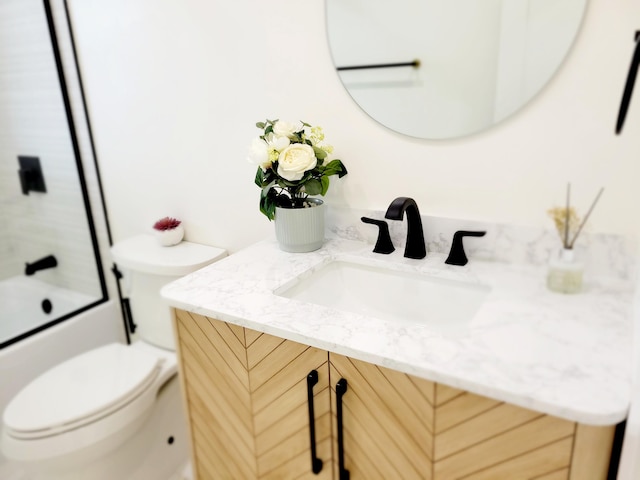 full bathroom with toilet, vanity, and combined bath / shower with glass door