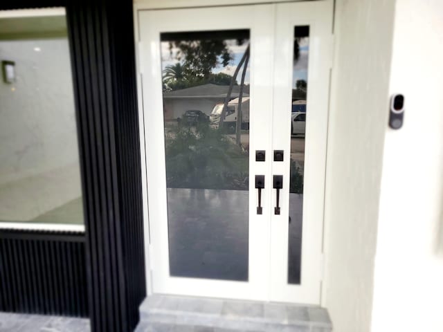 property entrance featuring french doors