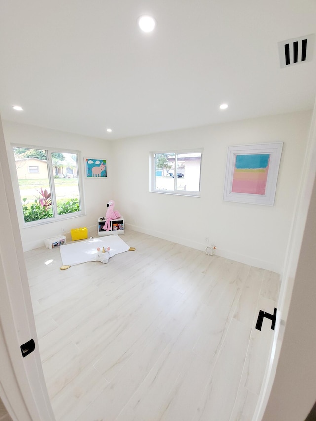 rec room featuring light hardwood / wood-style flooring