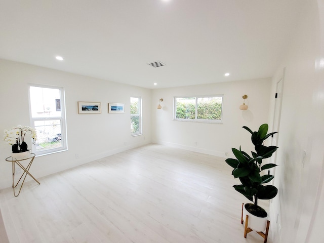 spare room featuring light hardwood / wood-style flooring