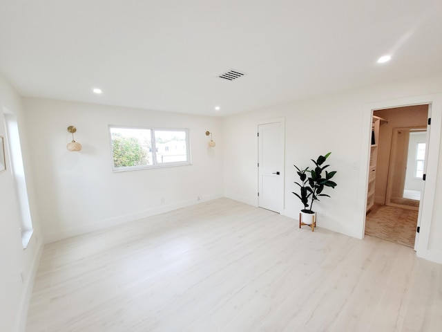 empty room with light hardwood / wood-style floors