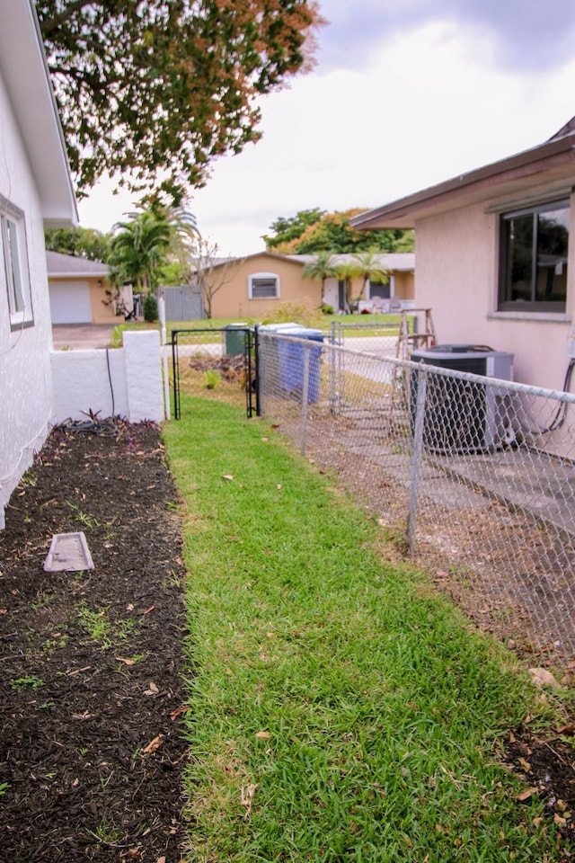 view of yard with central AC unit