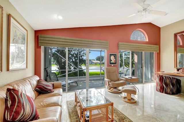 living room with vaulted ceiling and ceiling fan