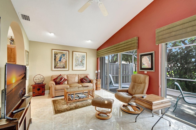 living room with ceiling fan and lofted ceiling