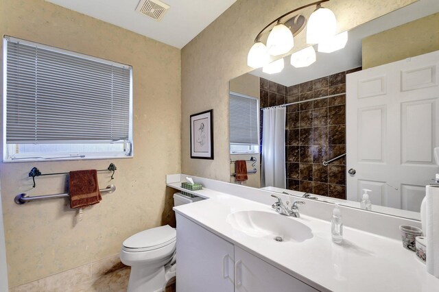 bathroom with an inviting chandelier, toilet, a shower with shower curtain, and vanity