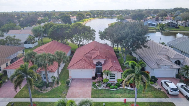 birds eye view of property featuring a water view