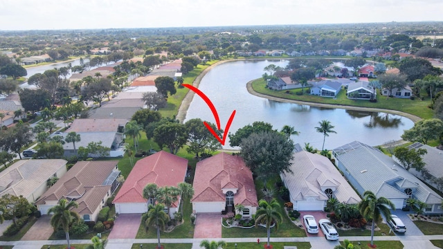 birds eye view of property with a water view