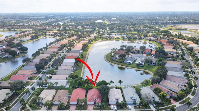 birds eye view of property featuring a water view