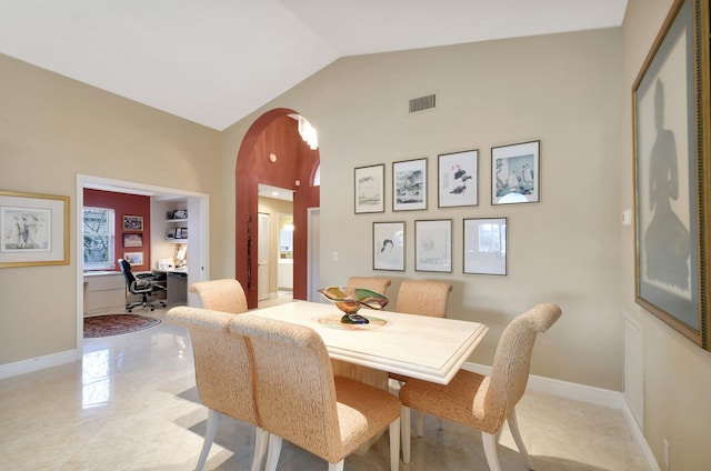 dining room with lofted ceiling