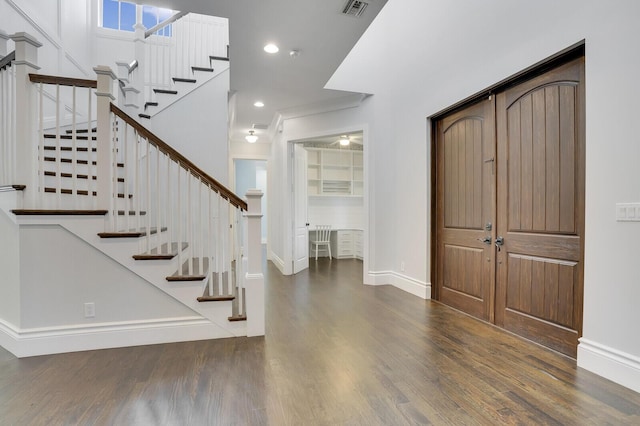 entrance foyer featuring dark hardwood / wood-style flooring