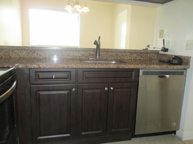 kitchen featuring dishwasher, an inviting chandelier, dark brown cabinets, a sink, and light tile patterned flooring