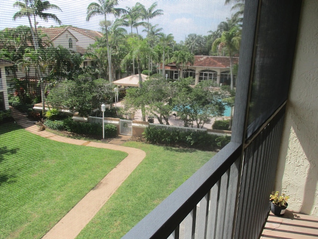 view of yard featuring a balcony