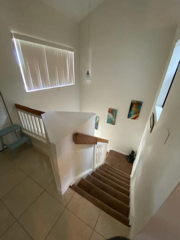 staircase with tile patterned flooring