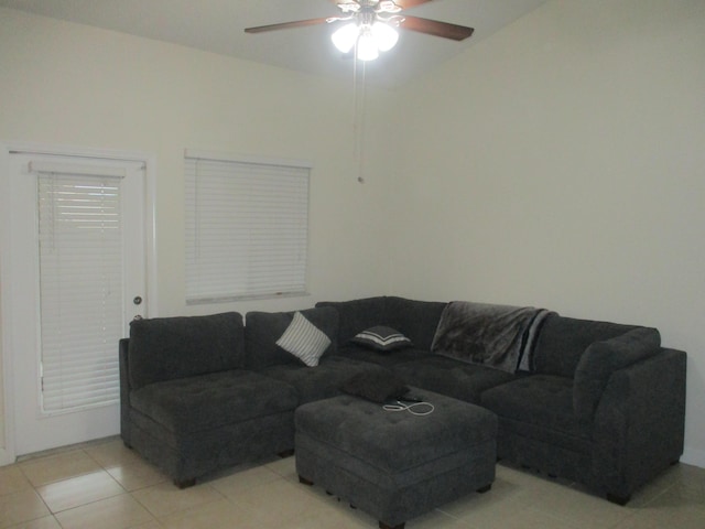 tiled living room featuring ceiling fan