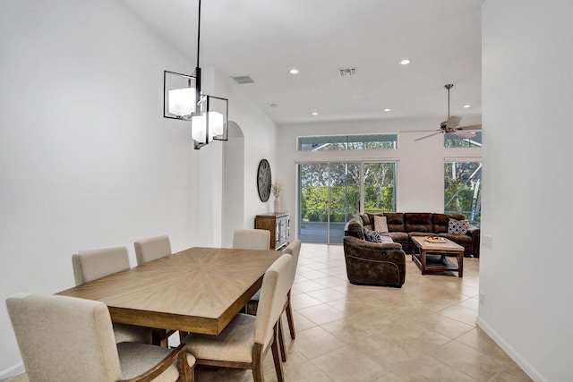 tiled dining area featuring ceiling fan