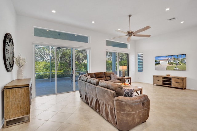 tiled living room with ceiling fan