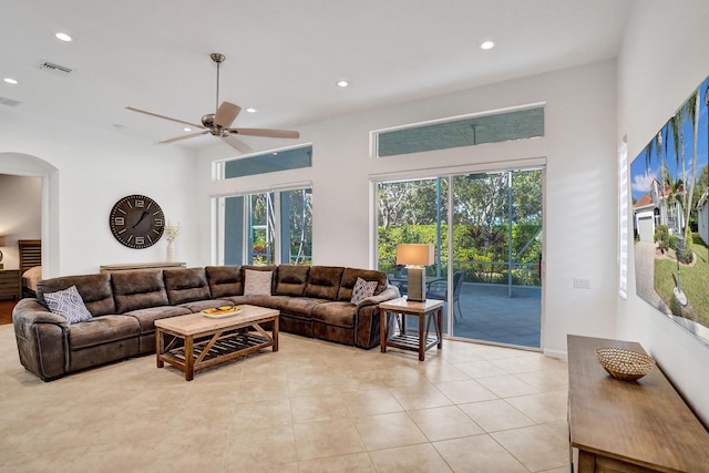 living room with ceiling fan and light tile patterned floors