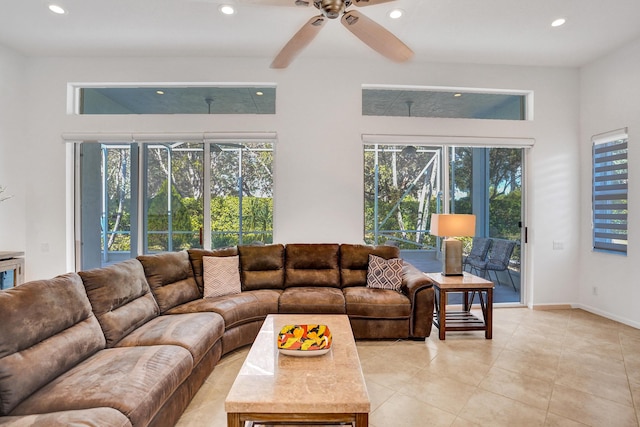 living room with ceiling fan and a healthy amount of sunlight