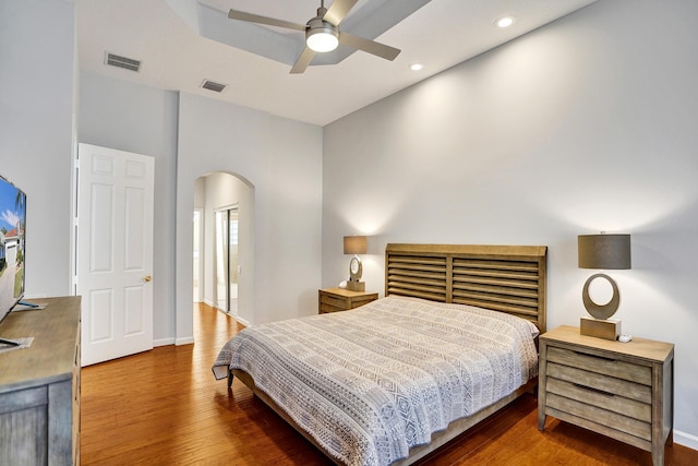 bedroom with dark wood-type flooring and ceiling fan