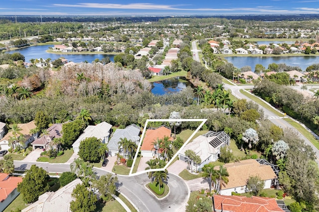 bird's eye view with a water view