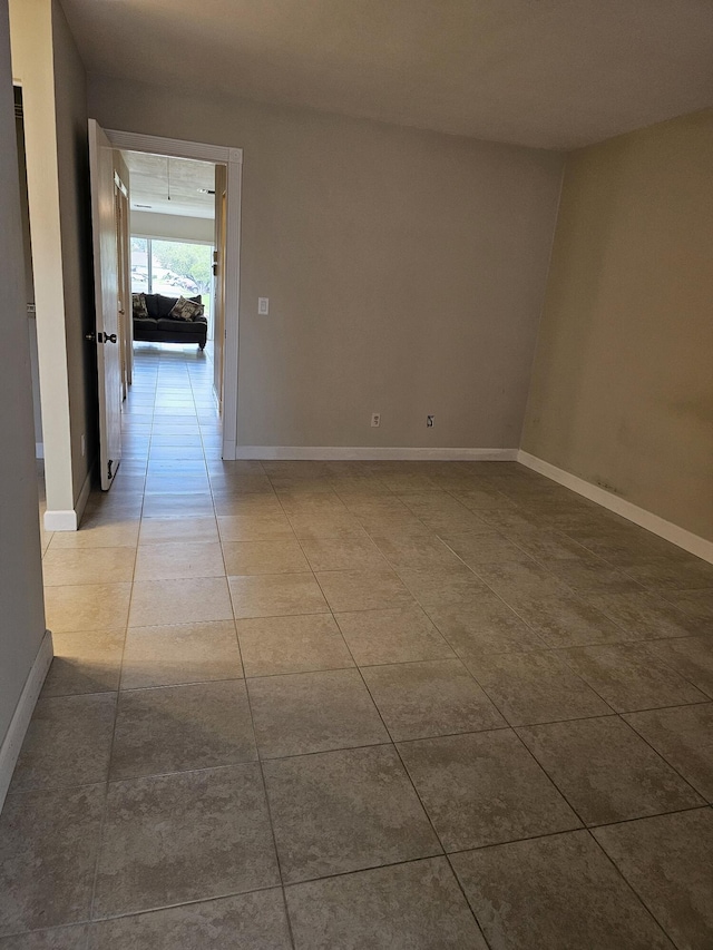 empty room with tile patterned flooring