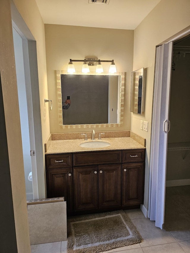 bathroom featuring tile patterned floors and vanity