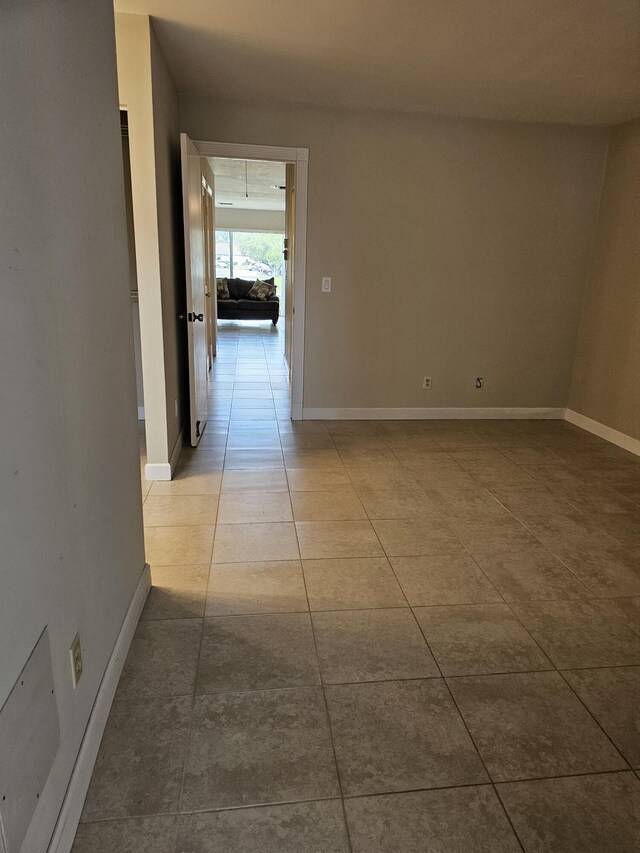 hall featuring light tile patterned floors