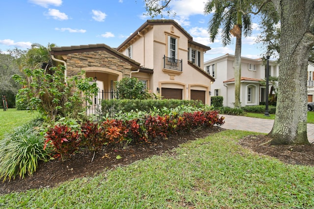 view of front of property with a garage and a front yard