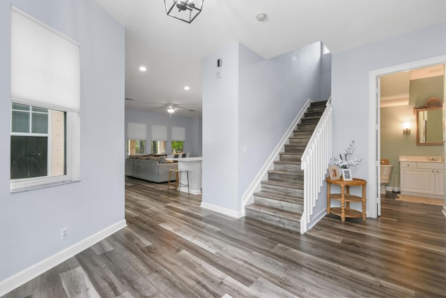 interior space featuring wood-type flooring and ceiling fan