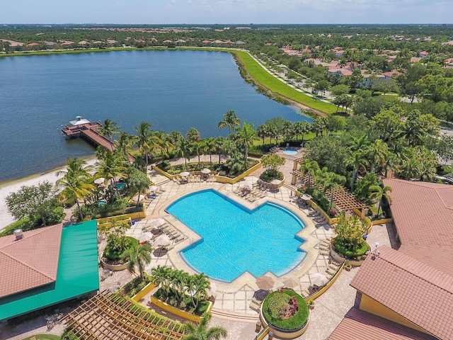 view of pool with a water view and a patio area