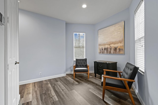 living area with hardwood / wood-style floors