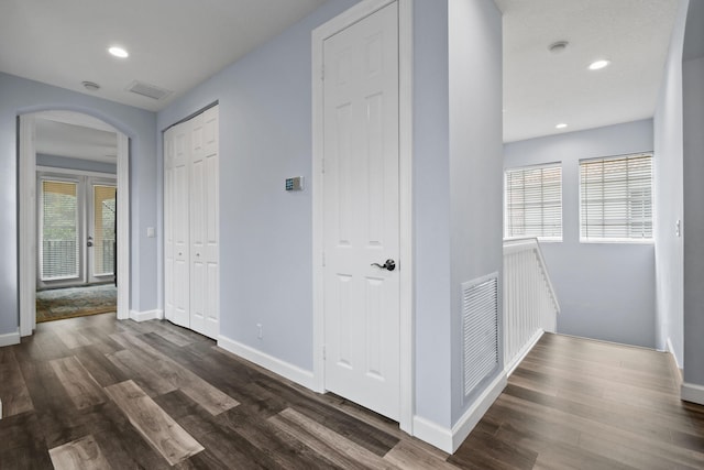 corridor featuring dark hardwood / wood-style flooring