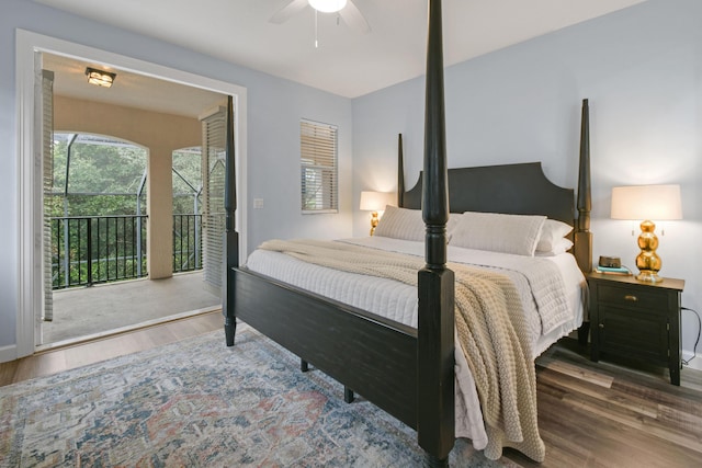 bedroom with ceiling fan, hardwood / wood-style floors, and access to outside