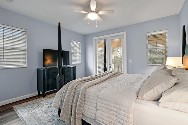 bedroom featuring access to exterior, hardwood / wood-style flooring, and ceiling fan