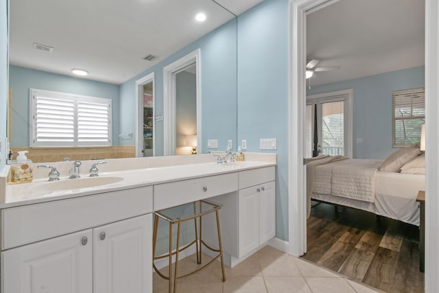 bathroom with tile patterned flooring, vanity, plenty of natural light, and ceiling fan