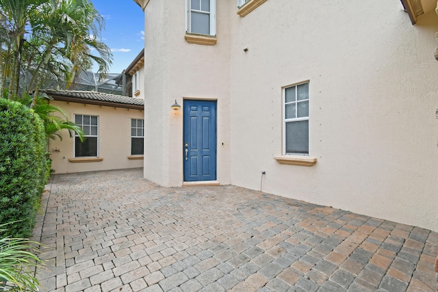 doorway to property featuring a patio area